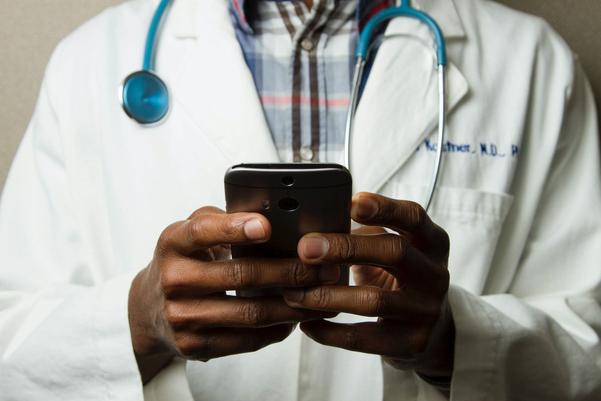 A doctor using a mobile phone
