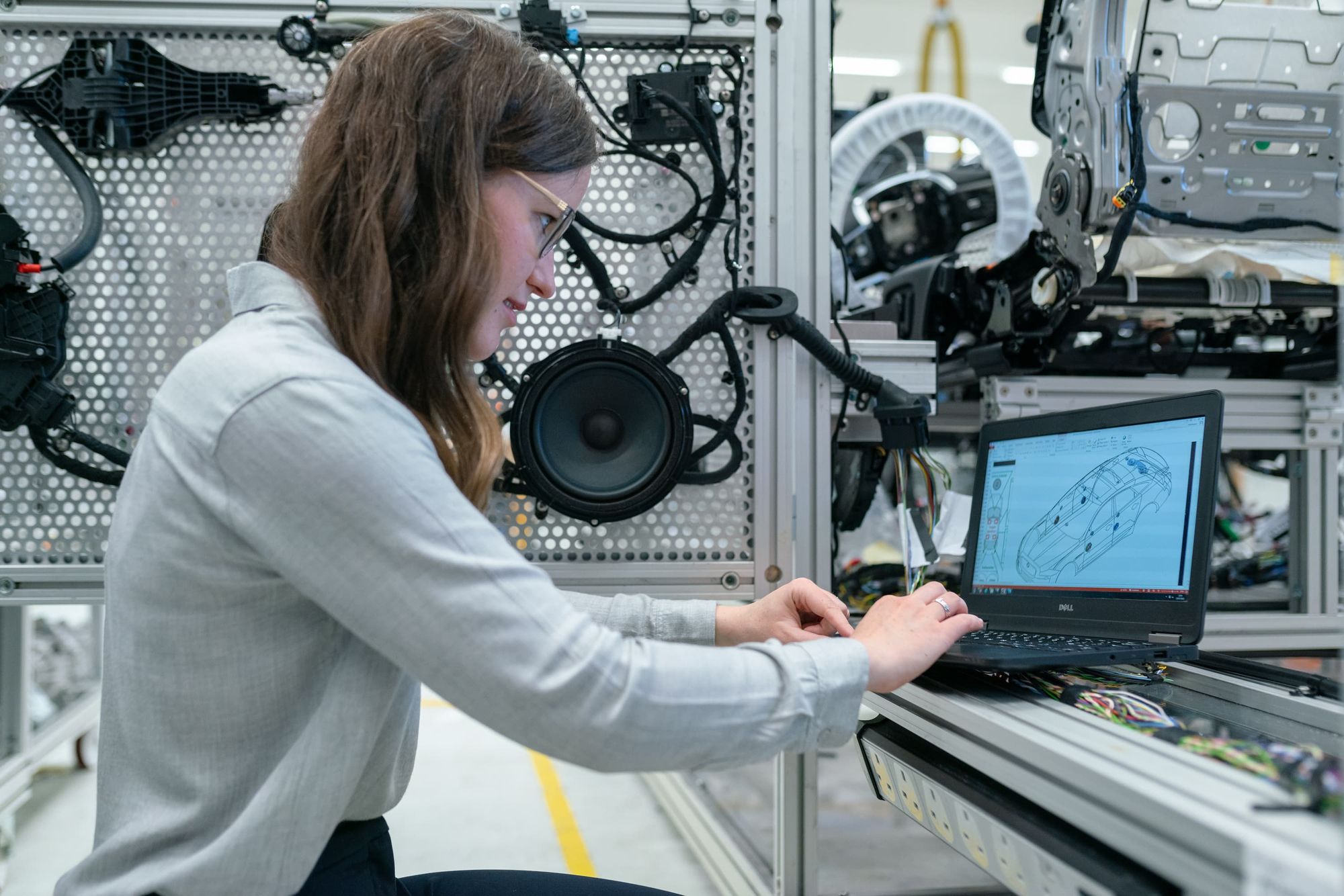 An engineer working in lab on a car design