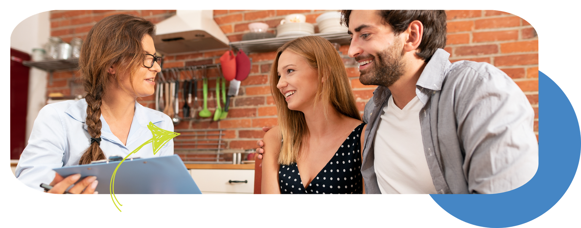 a couple and a real estate agent looking at a document on a kitchen setting